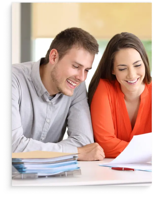 young happy couple reviewing legal documents