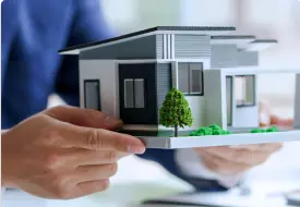 Toronto real estate lawyer portrait showing a house model, close up of his hands